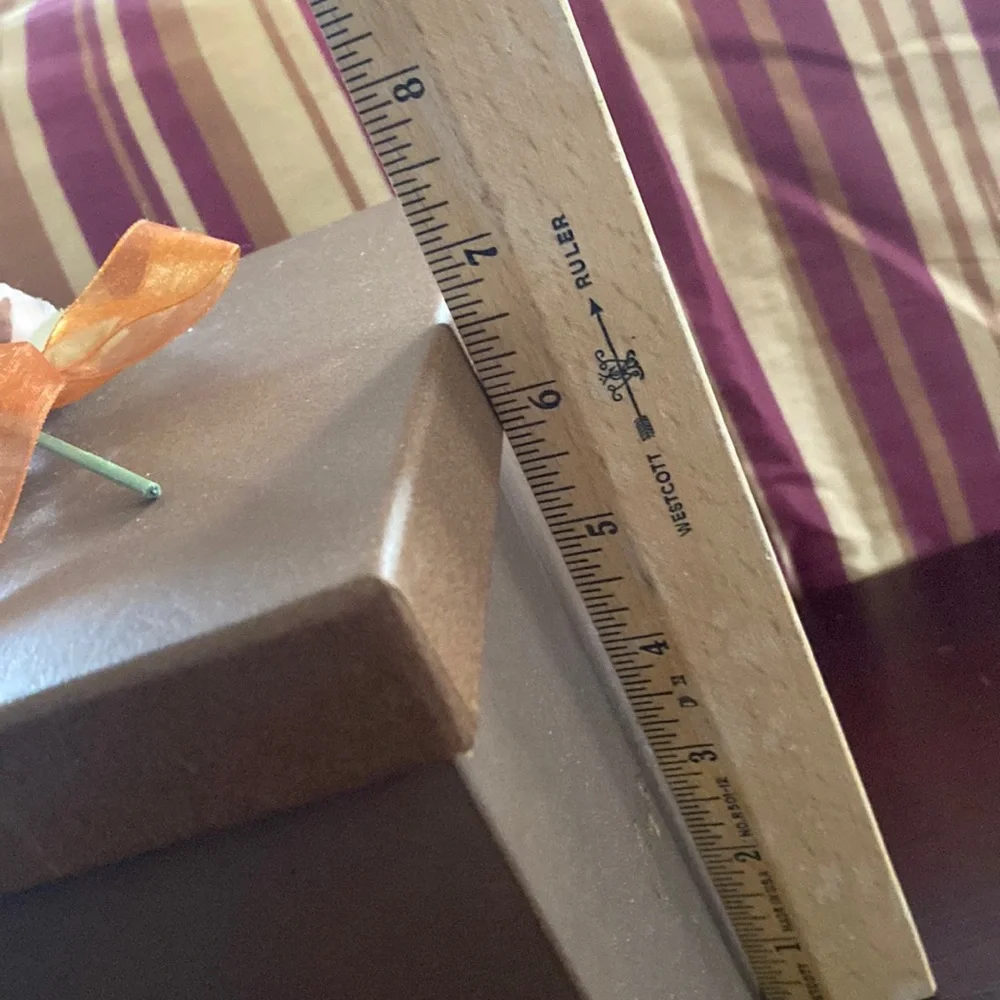 Pretty storage/gift box. Cardboard. Bronzish color with orange ribbon and flower